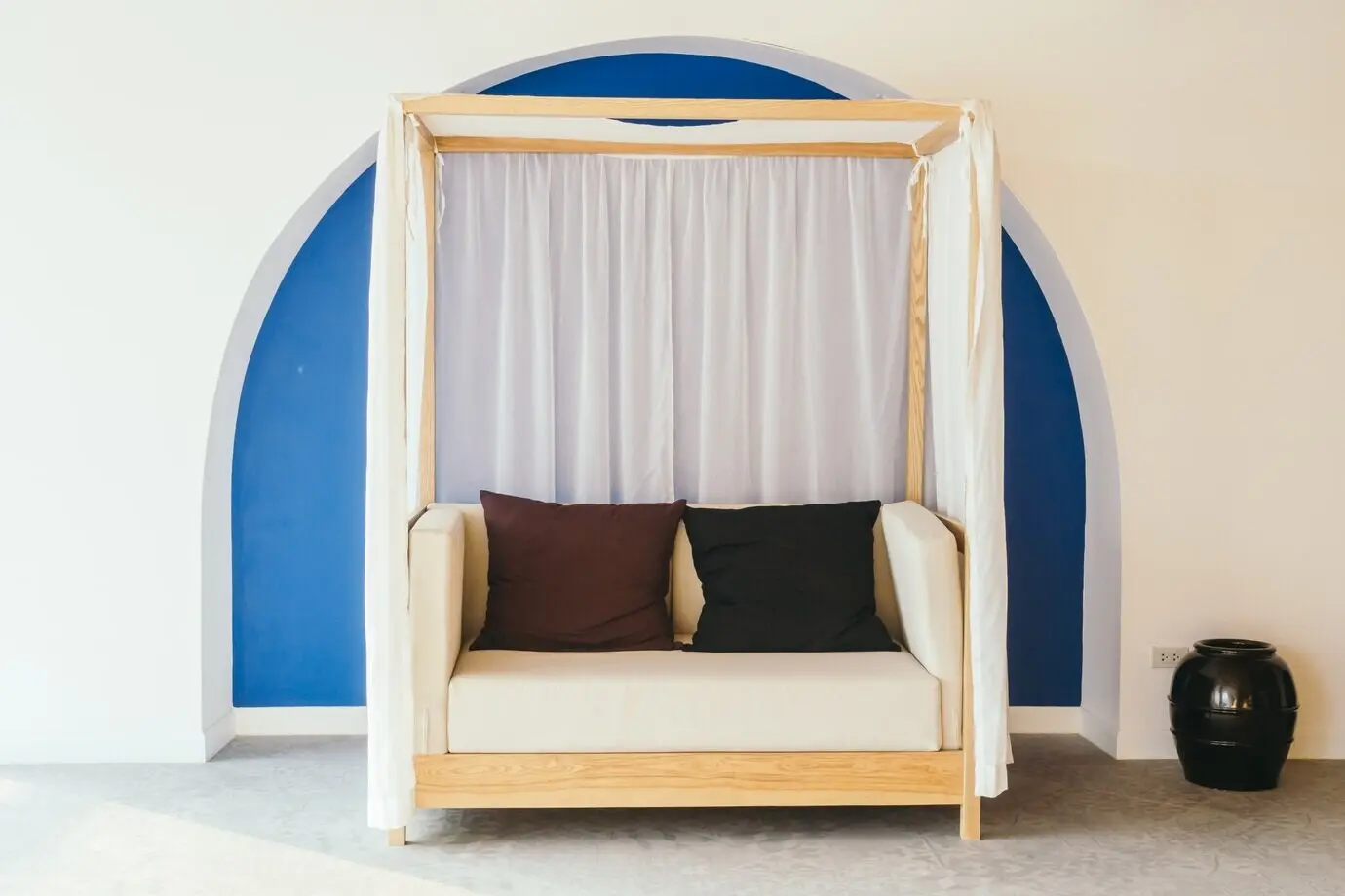 A comfortable couch/sofa in a bright loft